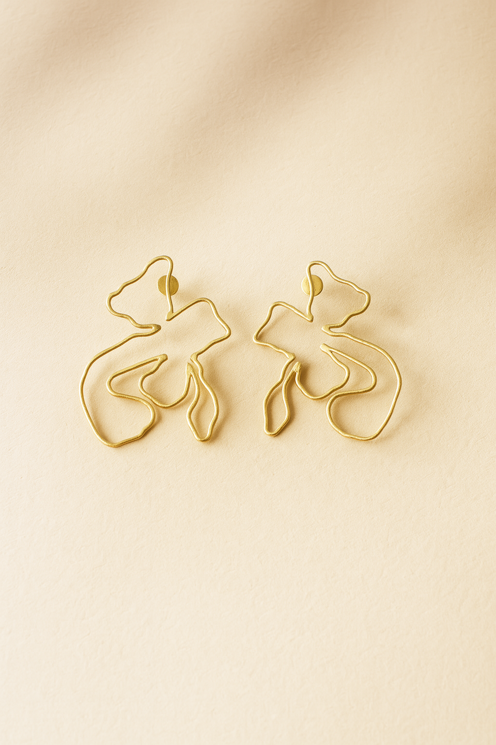 Naksh Floral Earrings on beige background